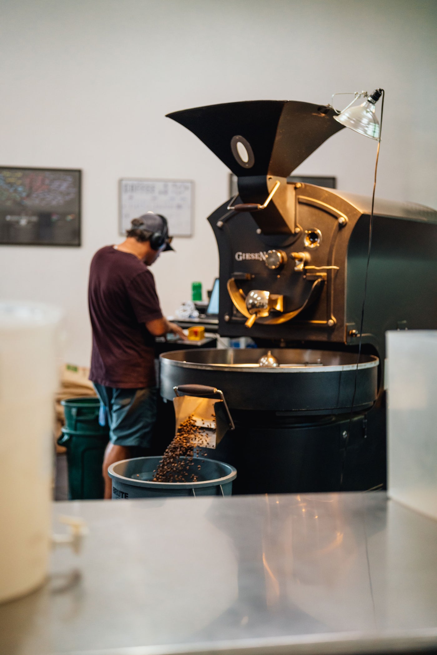A roaster emptying a fresh batch from the coffee roaster in Sandpoint