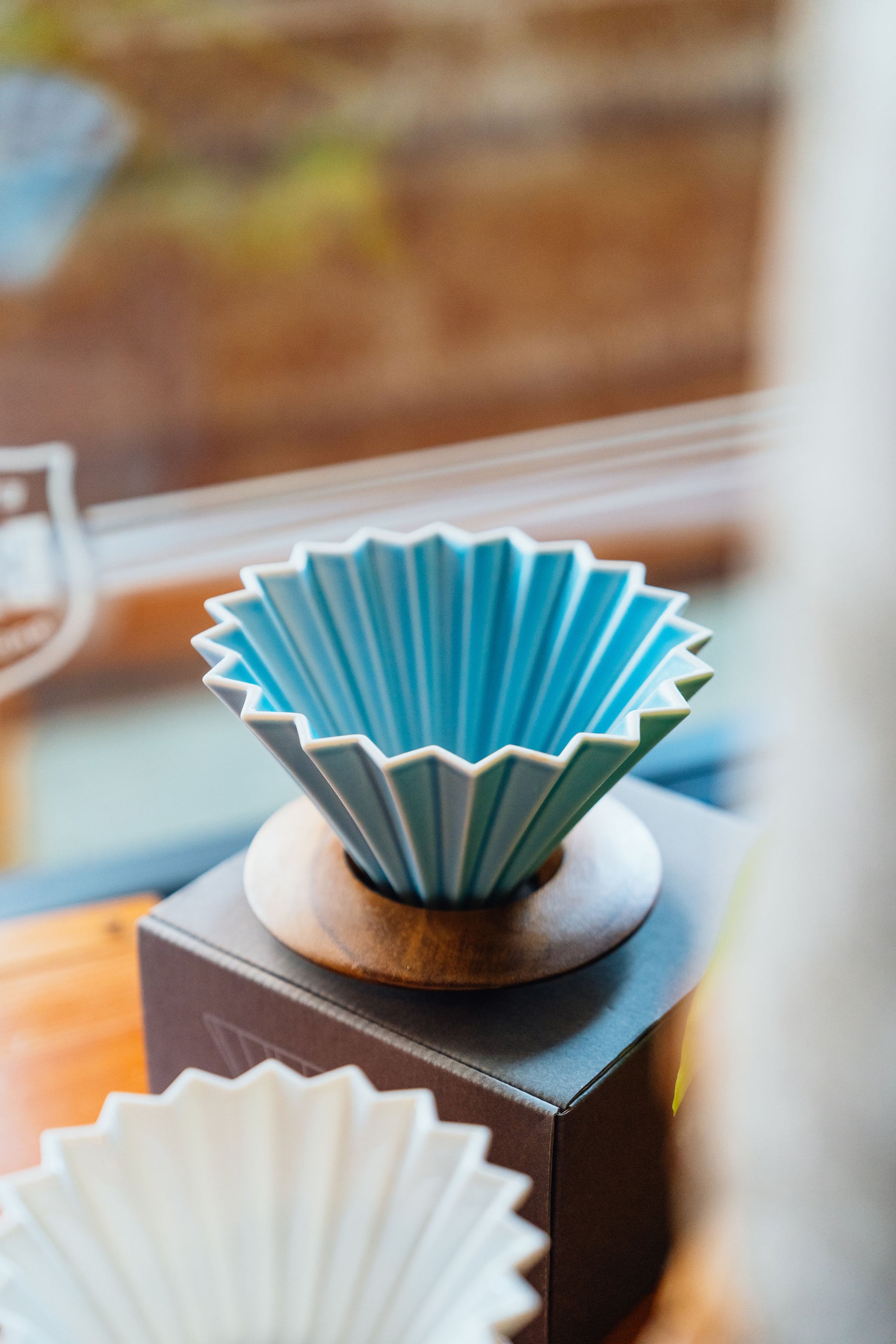 Origami pourover dripper on a brew stand